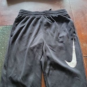 Black nike sweatpants with white speckle logo